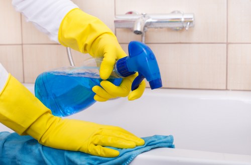 Curtain cleaning in a bright living room with neatly hanging drapes
