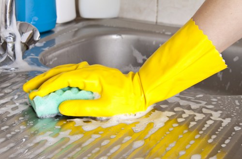 Technician using hot water extraction for carpet cleaning