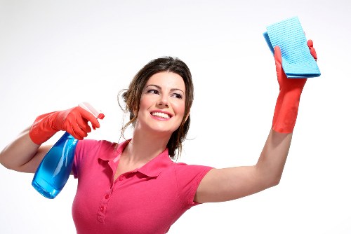 Steam cleaning a fabric couch to remove dirt and stains